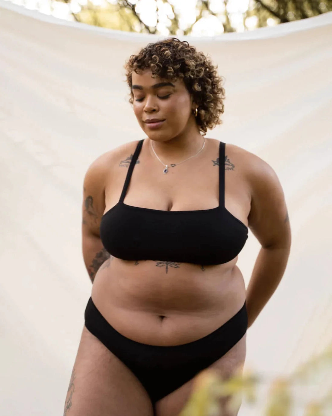 woman wearing black bikini underwear in modal by Huha with matching bralette