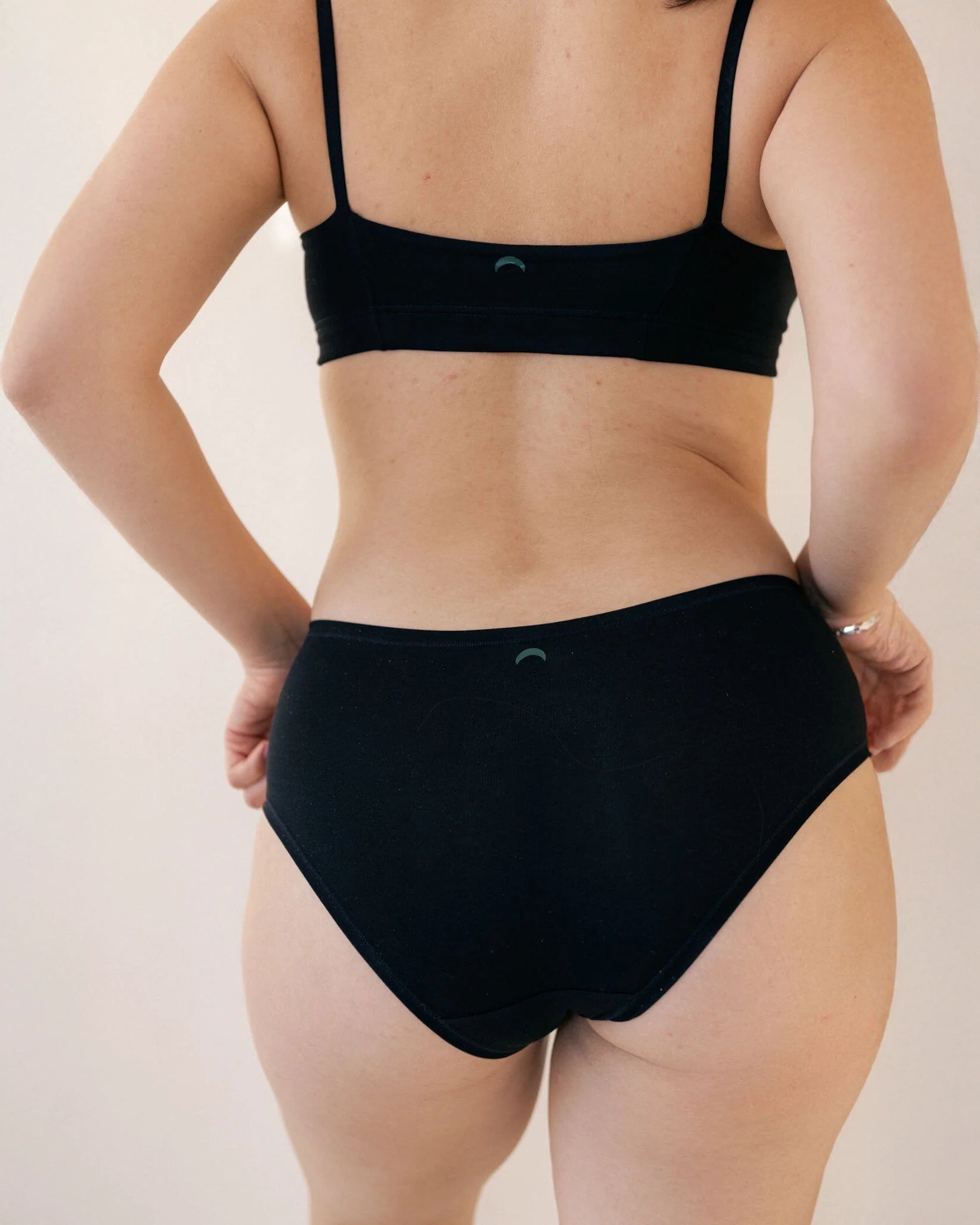 woman wearing black hipster boyshort underwear