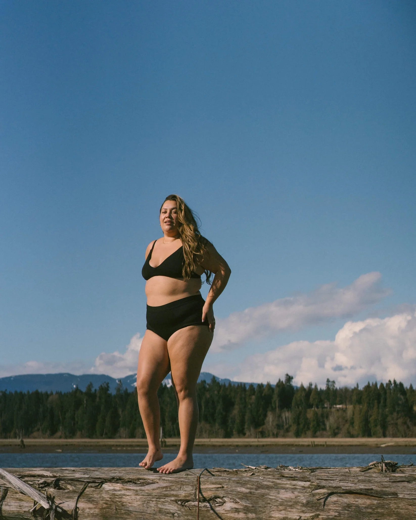 woman wearing black triangle wireless bra and undies in black modal fabric by Huha