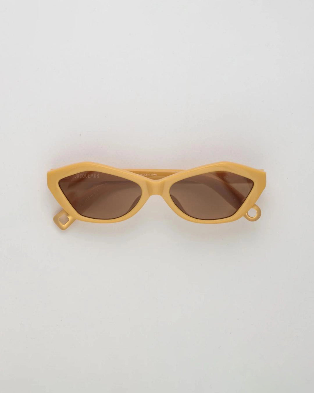 Yellow hexagonal sunglasses with brown lenses by Jacquemus