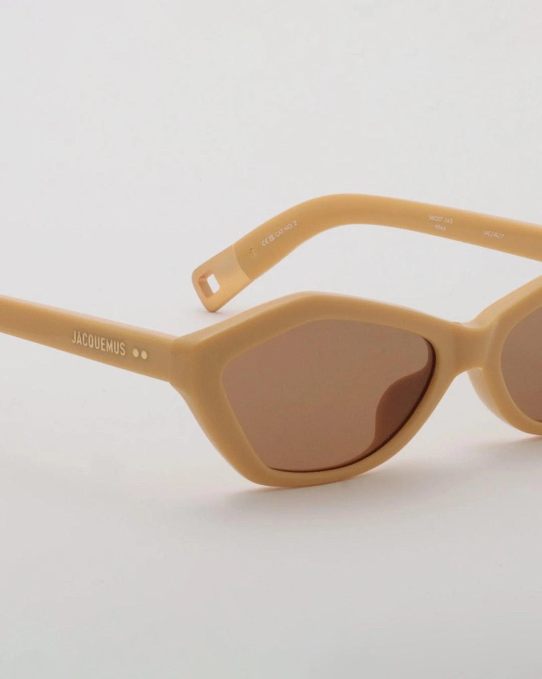 yellow hexagonal sunglasses with brown lenses by Jacquemus