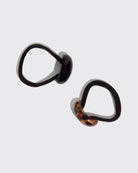 Black and tortoiseshell cloud-shaped hair cuffs with 'kitsch' packaging