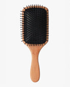 Hairbrush with bamboo wooden handle and black bristles