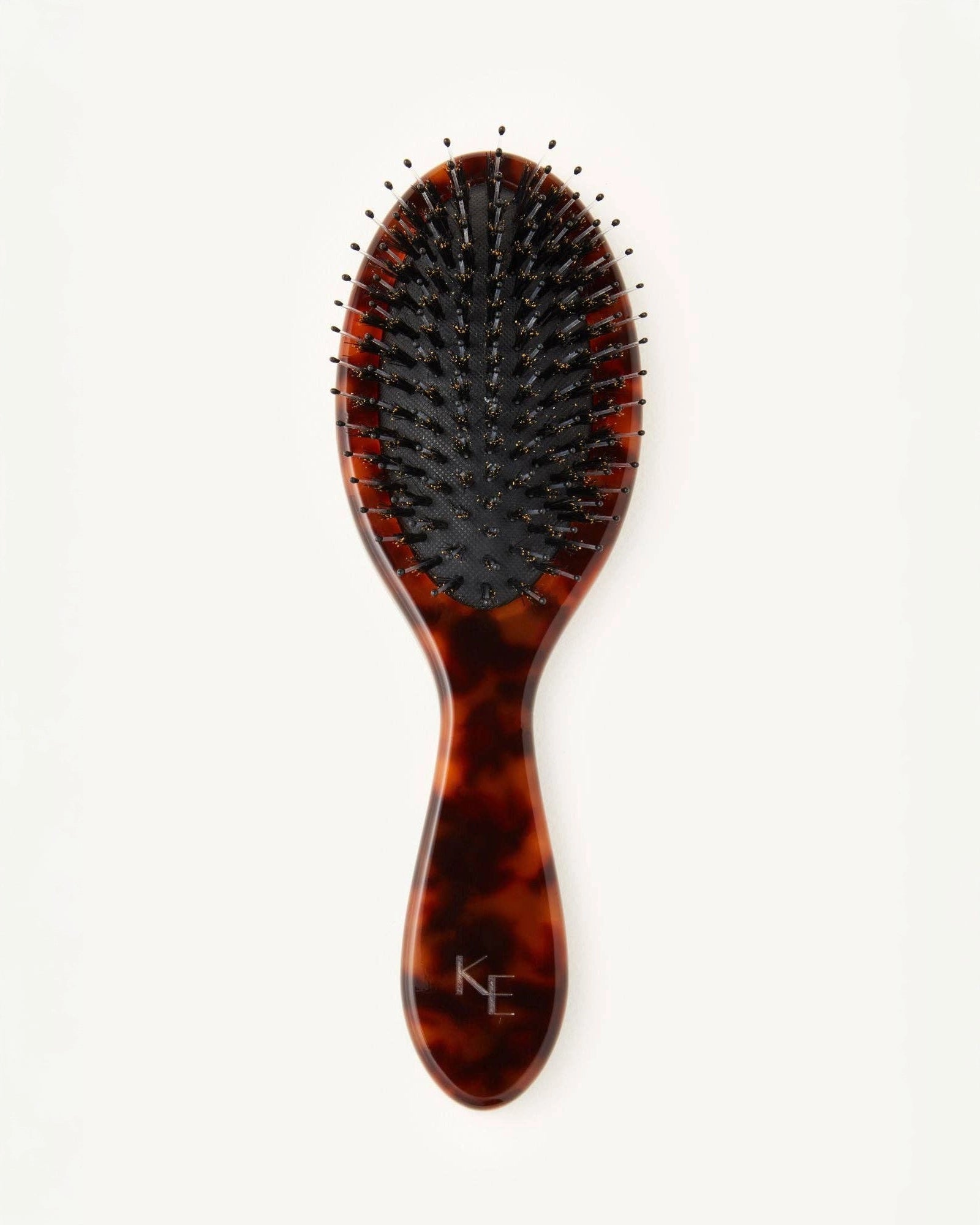 Tortoiseshell hairbrush with black bristles