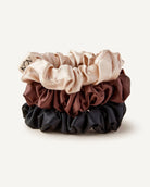 Set of three 100% silk scrunchies in beige, brown, and black