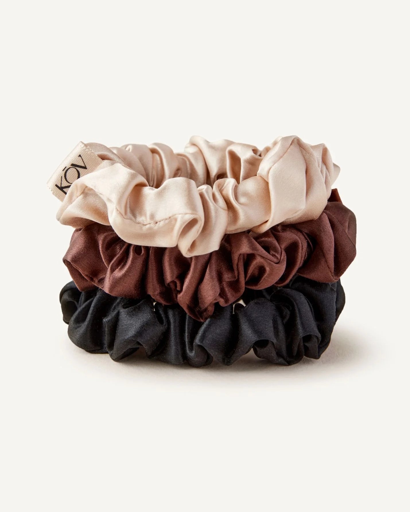 Set of three 100% silk scrunchies in beige, brown, and black
