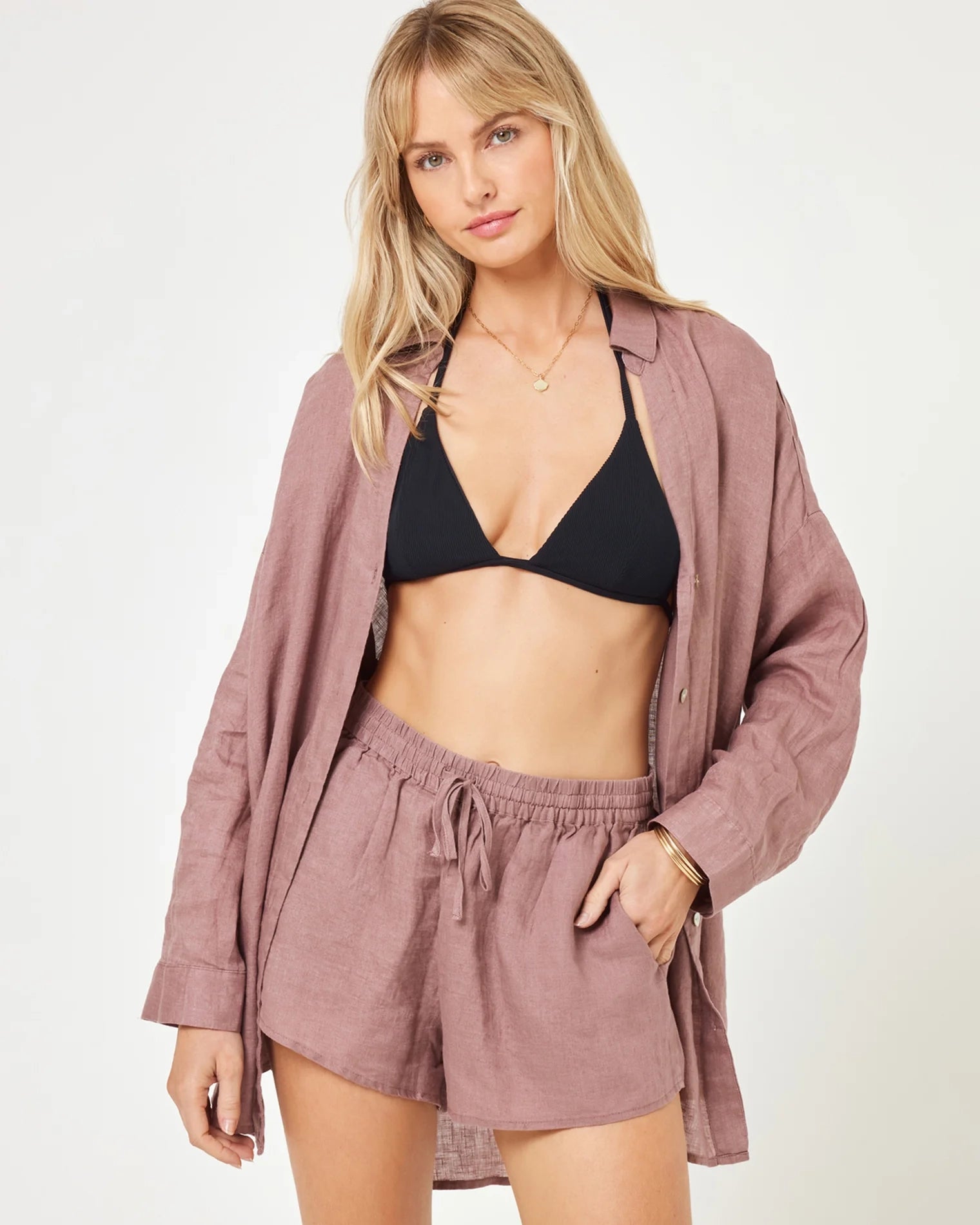 A model wearing smoky quartz-colored linen shorts with an adjustable tie waist