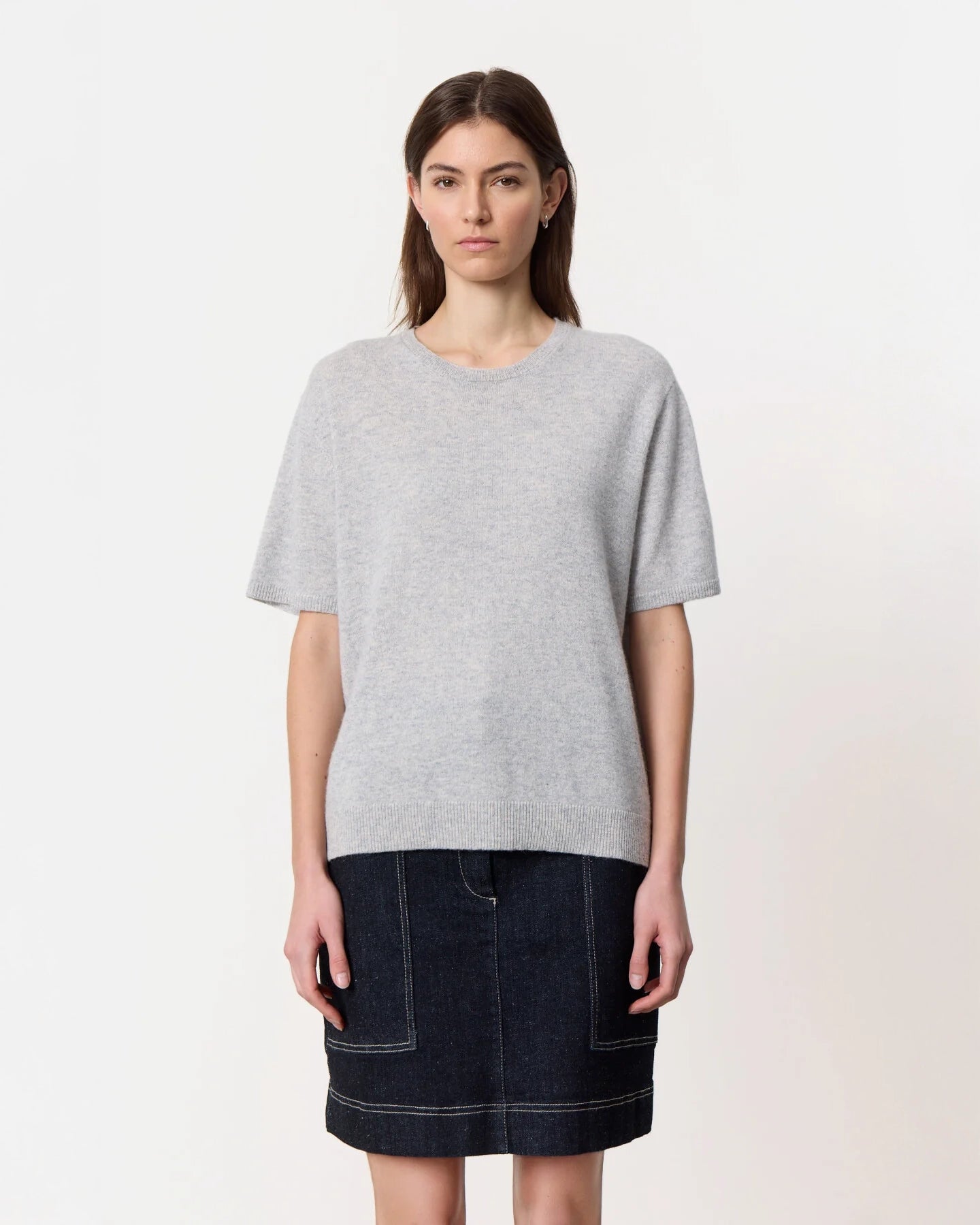 a woman wearing a crew neck oversized cashmere tee in grey