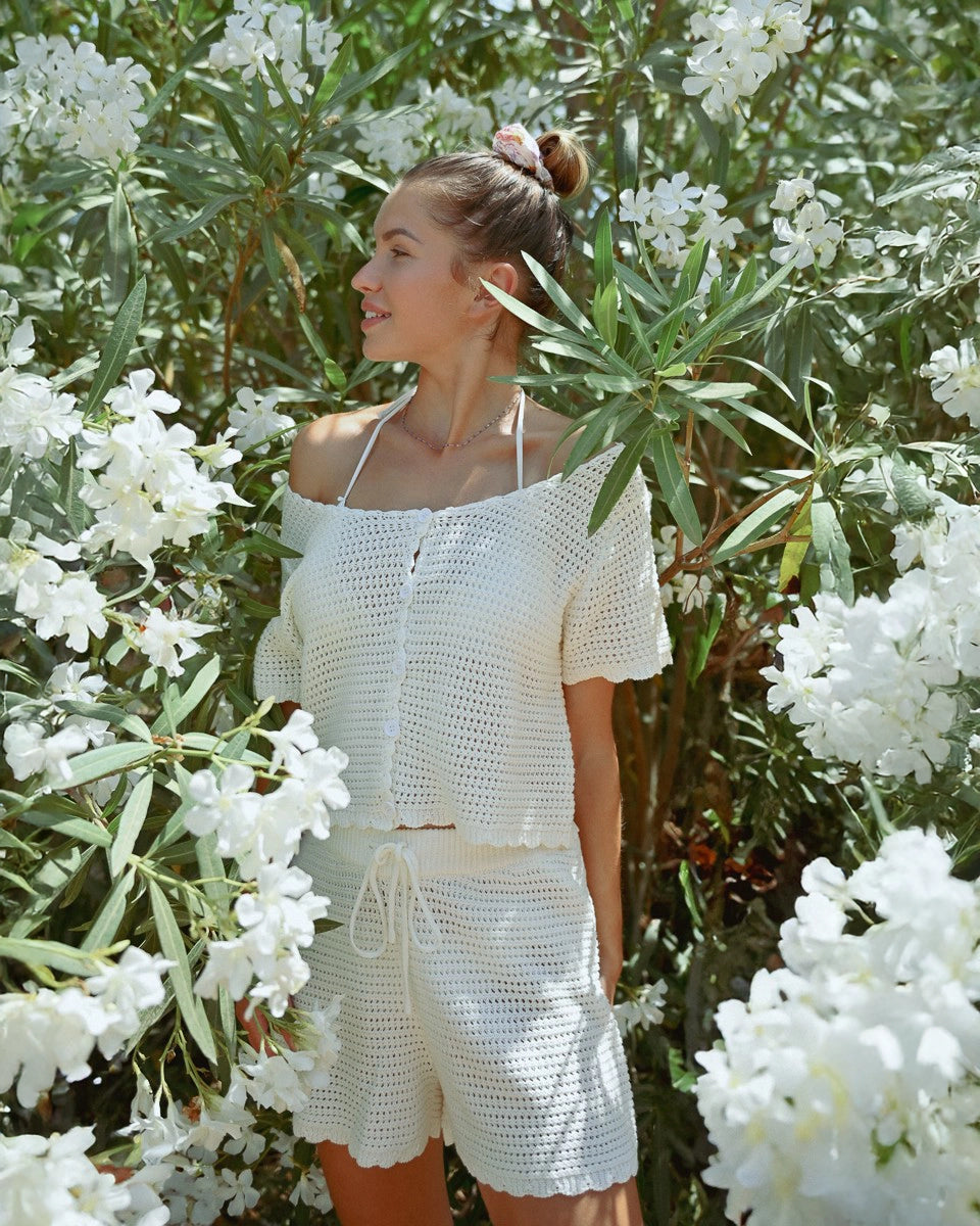Model wears Crochet Shorts in Cream