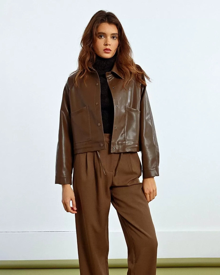 Woman wearing a brown leather jacket