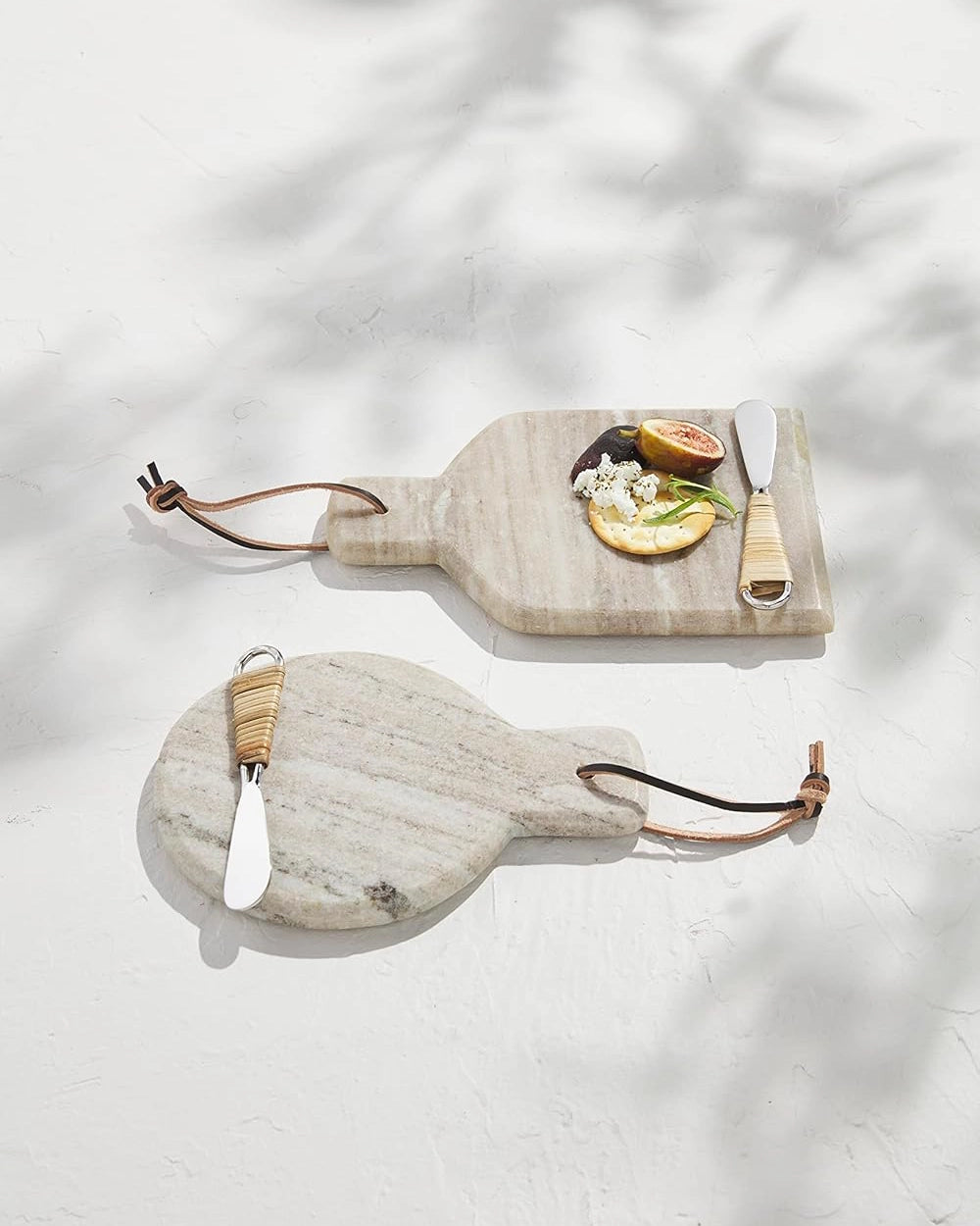 Two marble cutting boards with handles