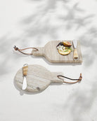 Two marble cutting boards with handles