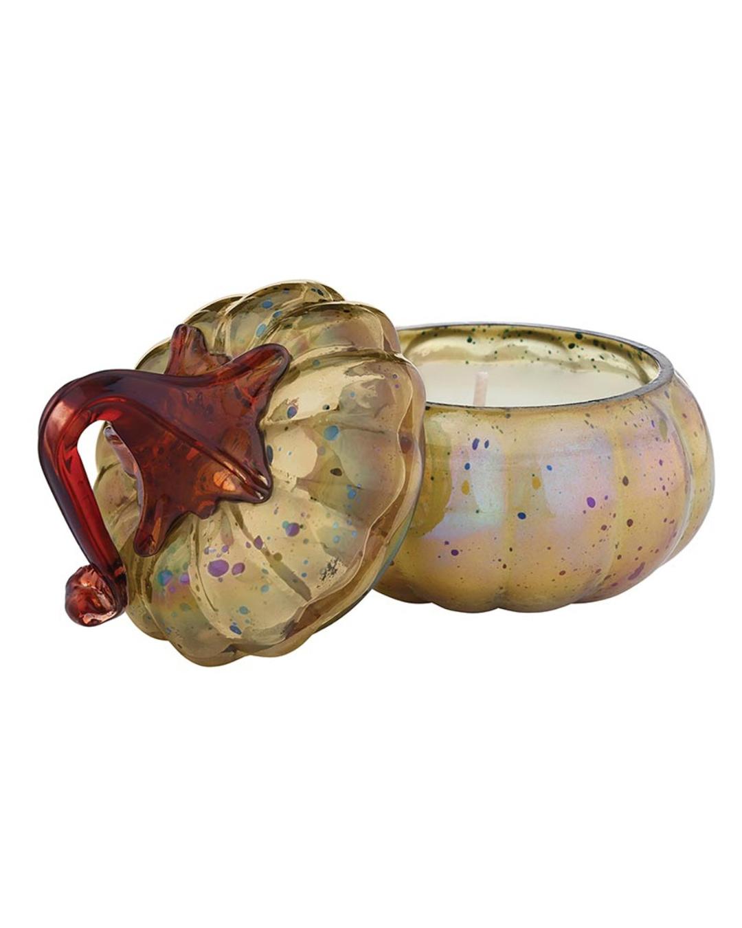 candle in a pumpkin shaped glass container