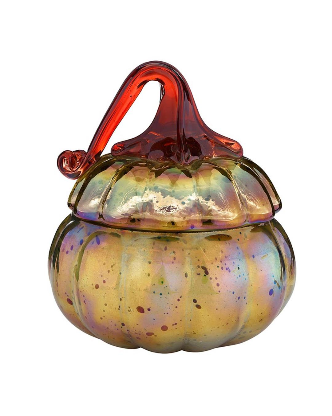 candle in a pumpkin shaped glass container