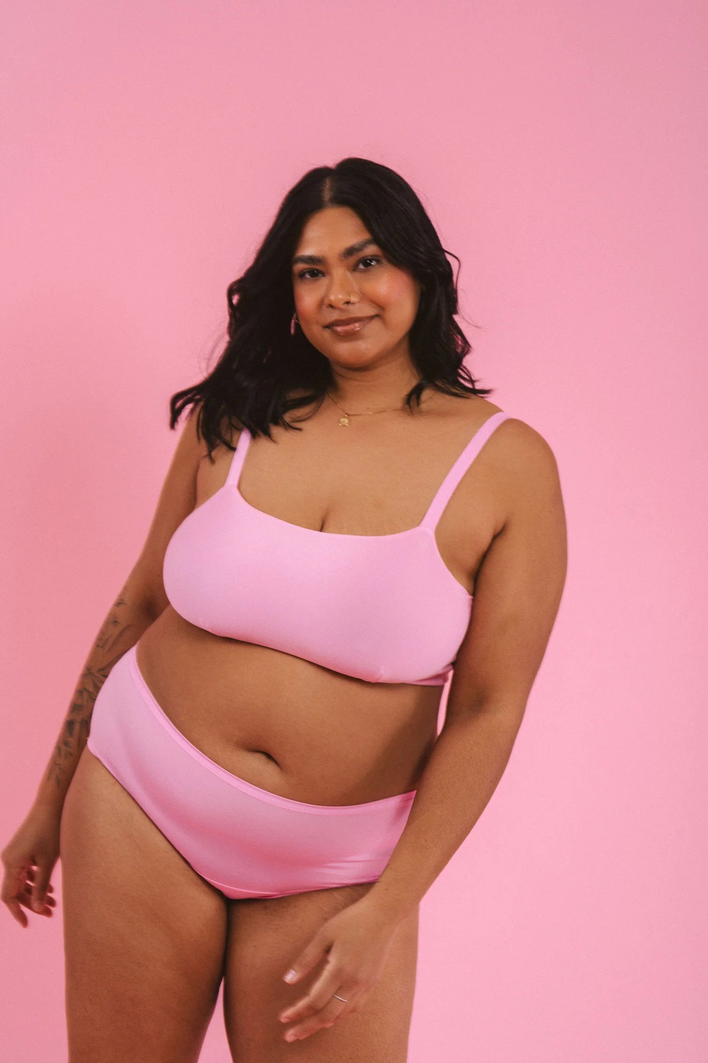 woman wearing pink hipster boyshort underwear and matching bralette