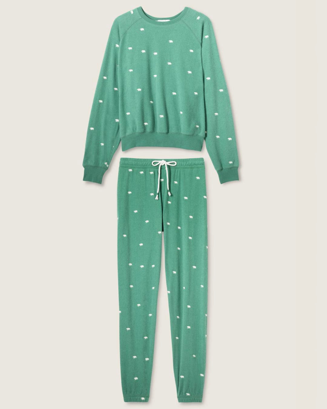 a green pajama set with white bears embroidered all over
