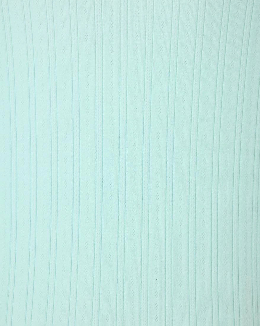 mint green fabric with a pointelle texture