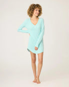a woman wears mint green sleepshirt with a pointelle texture