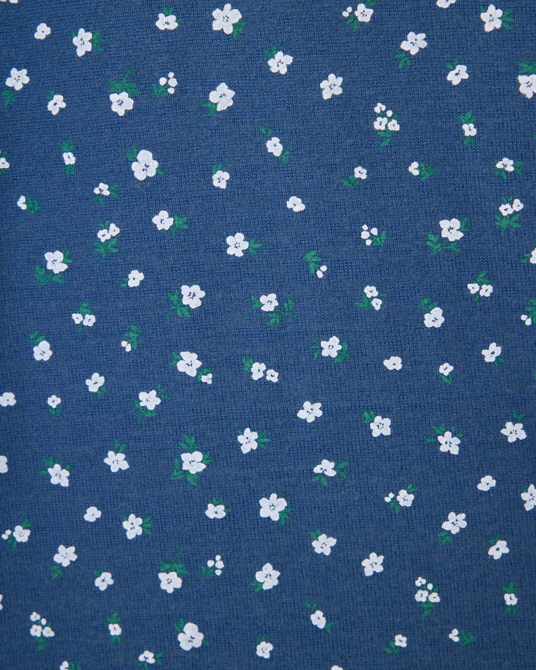 Blue fabric with small white floral pattern