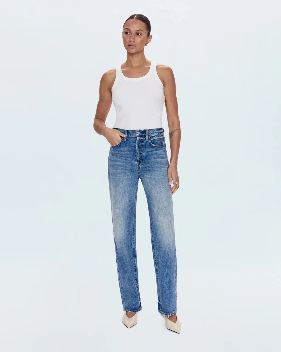 a woman wearing high rise straight jeans from Pistola