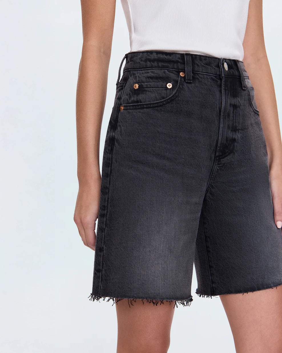 woman wearing black denim shorts