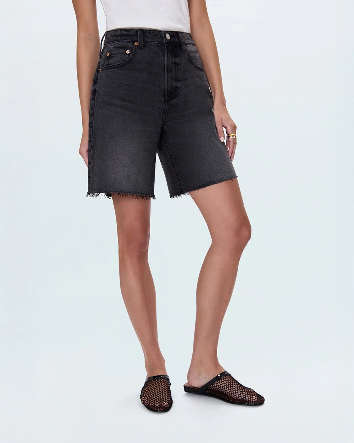 woman wearing black denim shorts