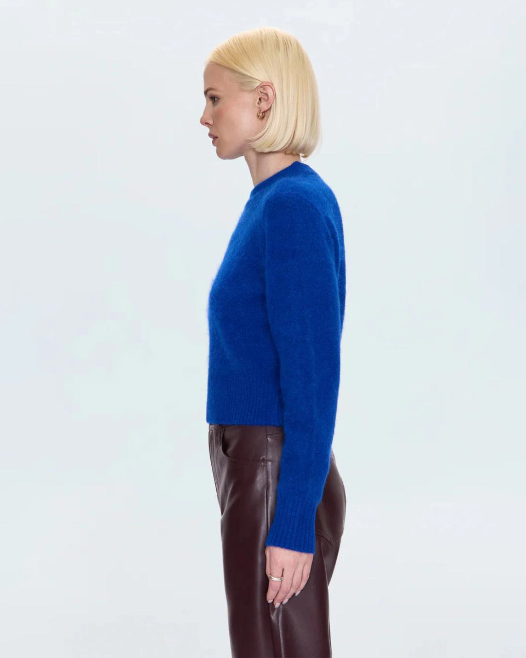 a woman wearing a cobalt blue alpaca crew neck sweater by Pistola