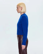 a woman wearing a cobalt blue alpaca crew neck sweater by Pistola