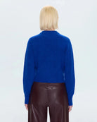 a woman wearing a cobalt blue alpaca crew neck sweater by Pistola