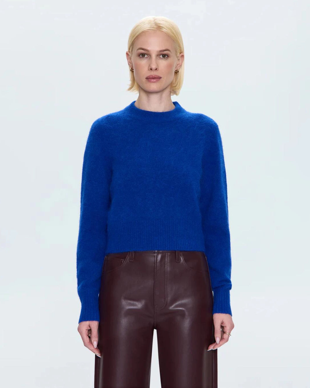 a woman wearing a cobalt blue alpaca crew neck sweater by Pistola