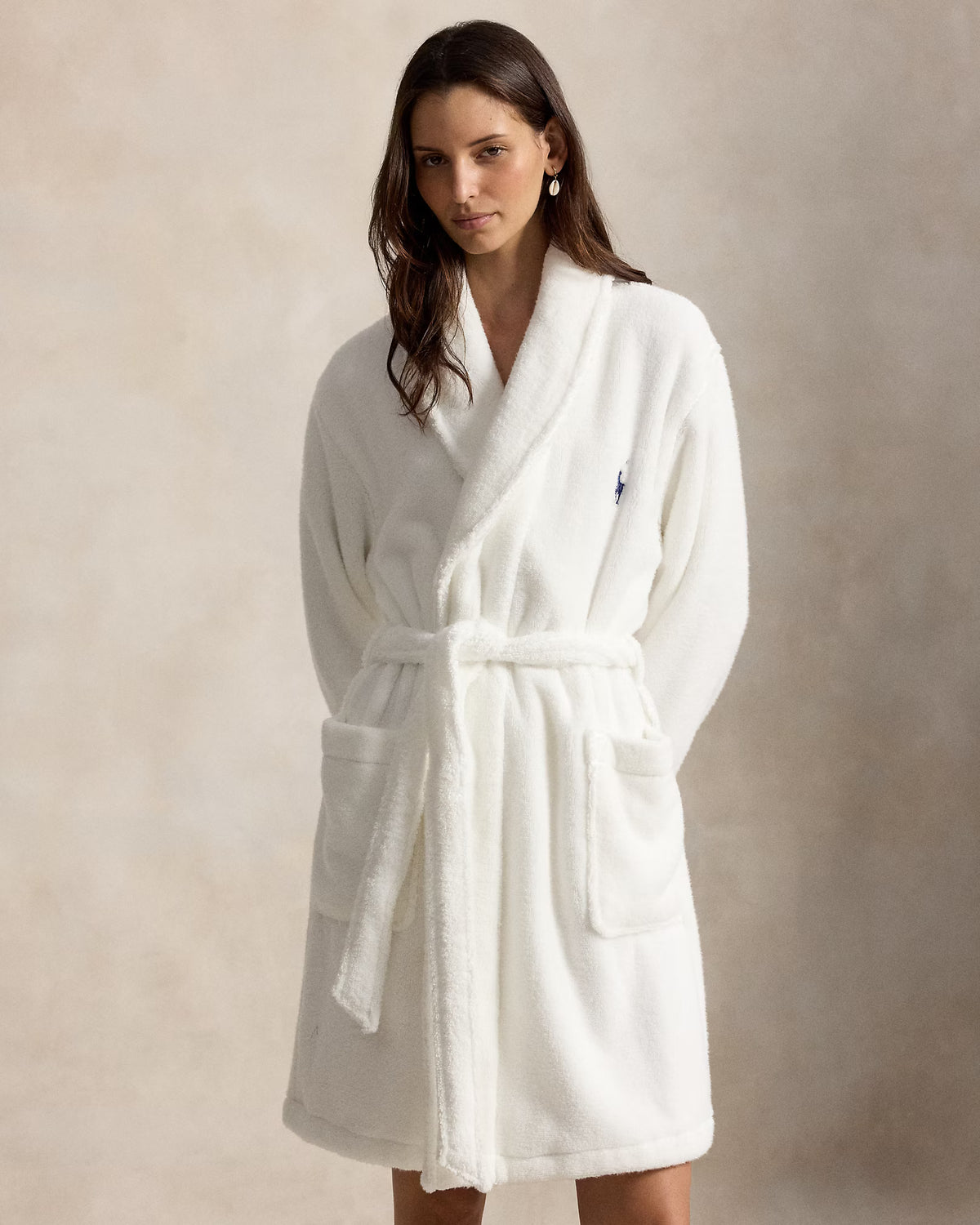 a short cotton terry bathrobe with the polo ralph lauren logo on the chest and a large bear embroidered on the back