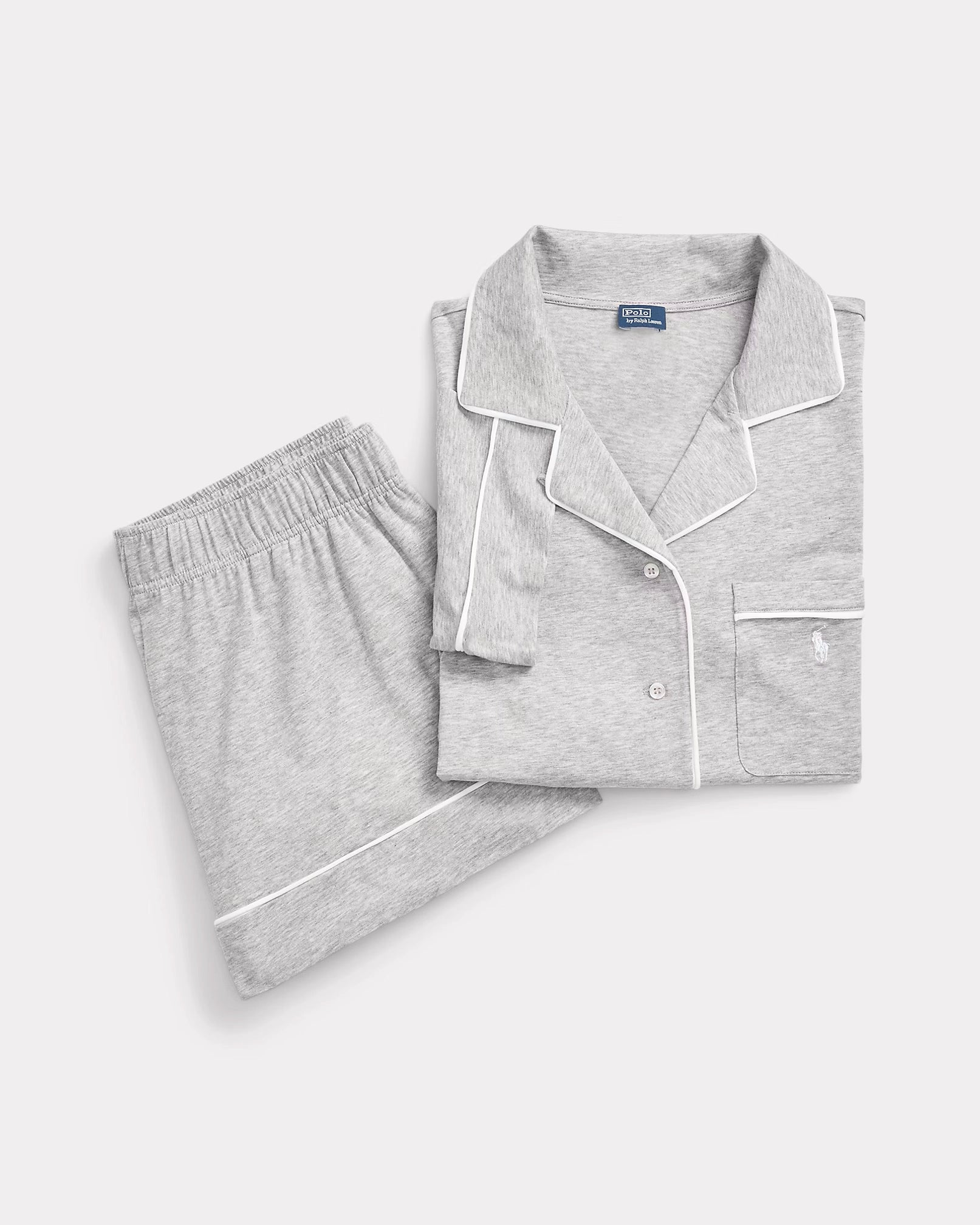 a short-sleeve and short pajama set in heather grey with contrast piping and a signature embroidered Pony on the chest.