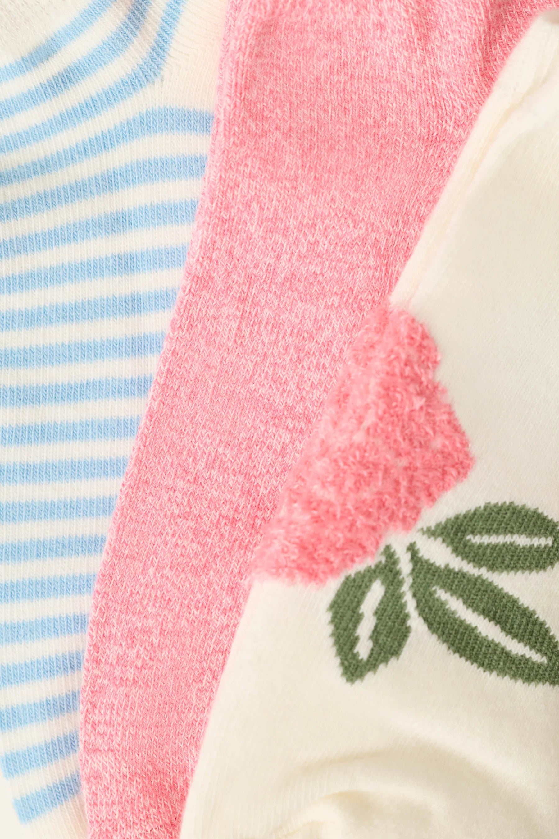 three pack of angle socks in white, blue and pink