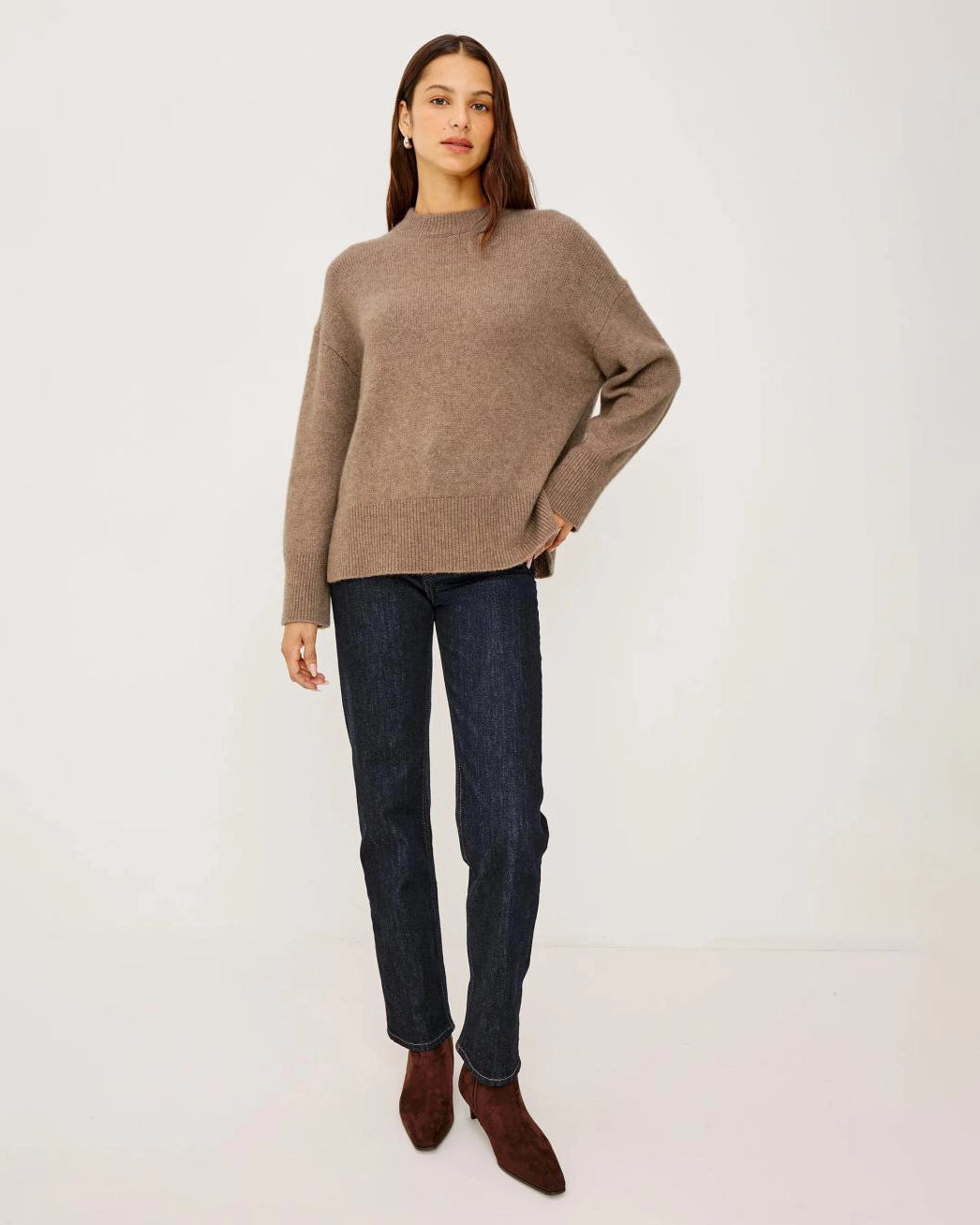 a woman wears a brown cashmere sweater