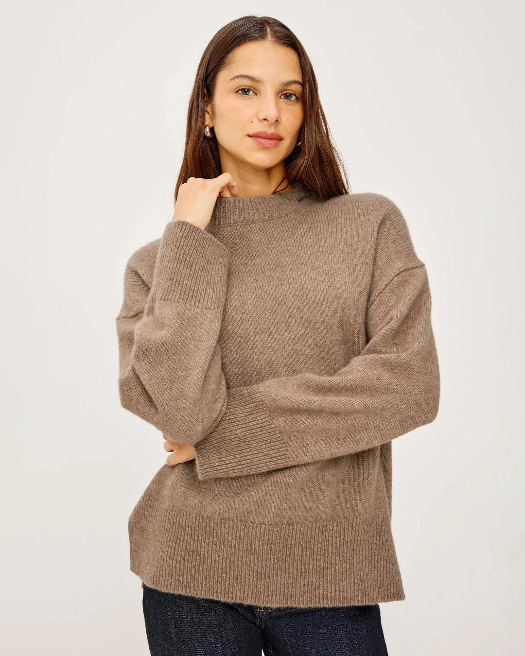 a woman wears a brown cashmere sweater