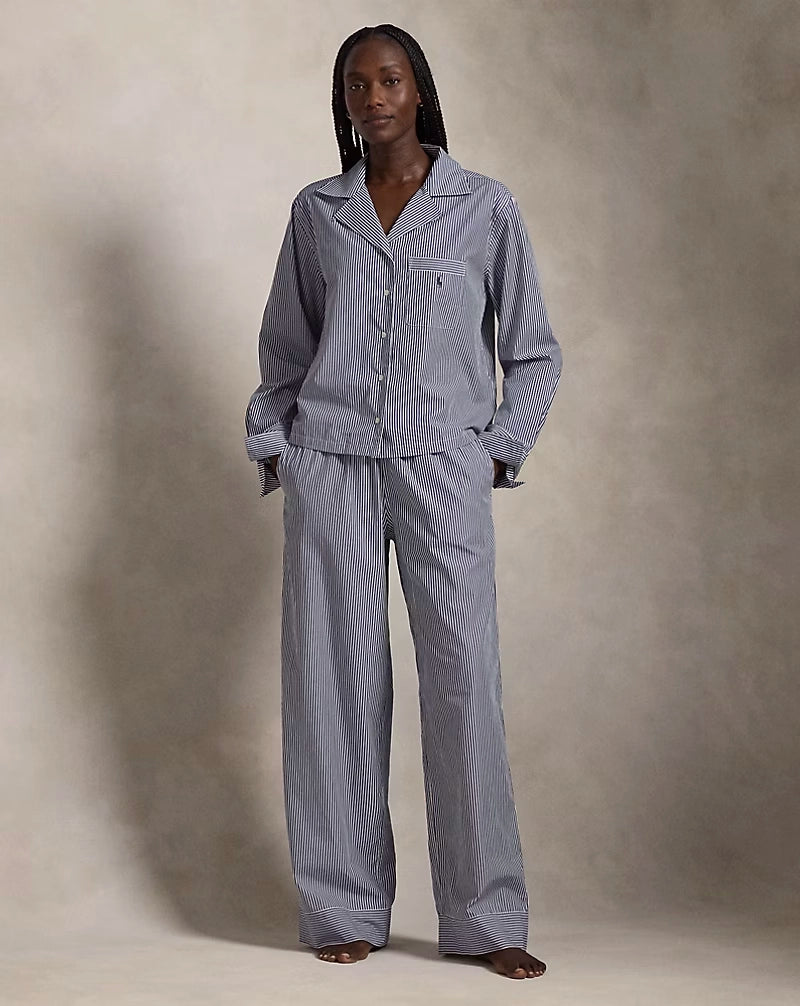 a lady wears a matching pajama set in blue stripes by ralph lauren