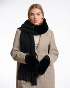 woman wearing faux fur knitted mitten gloves in black