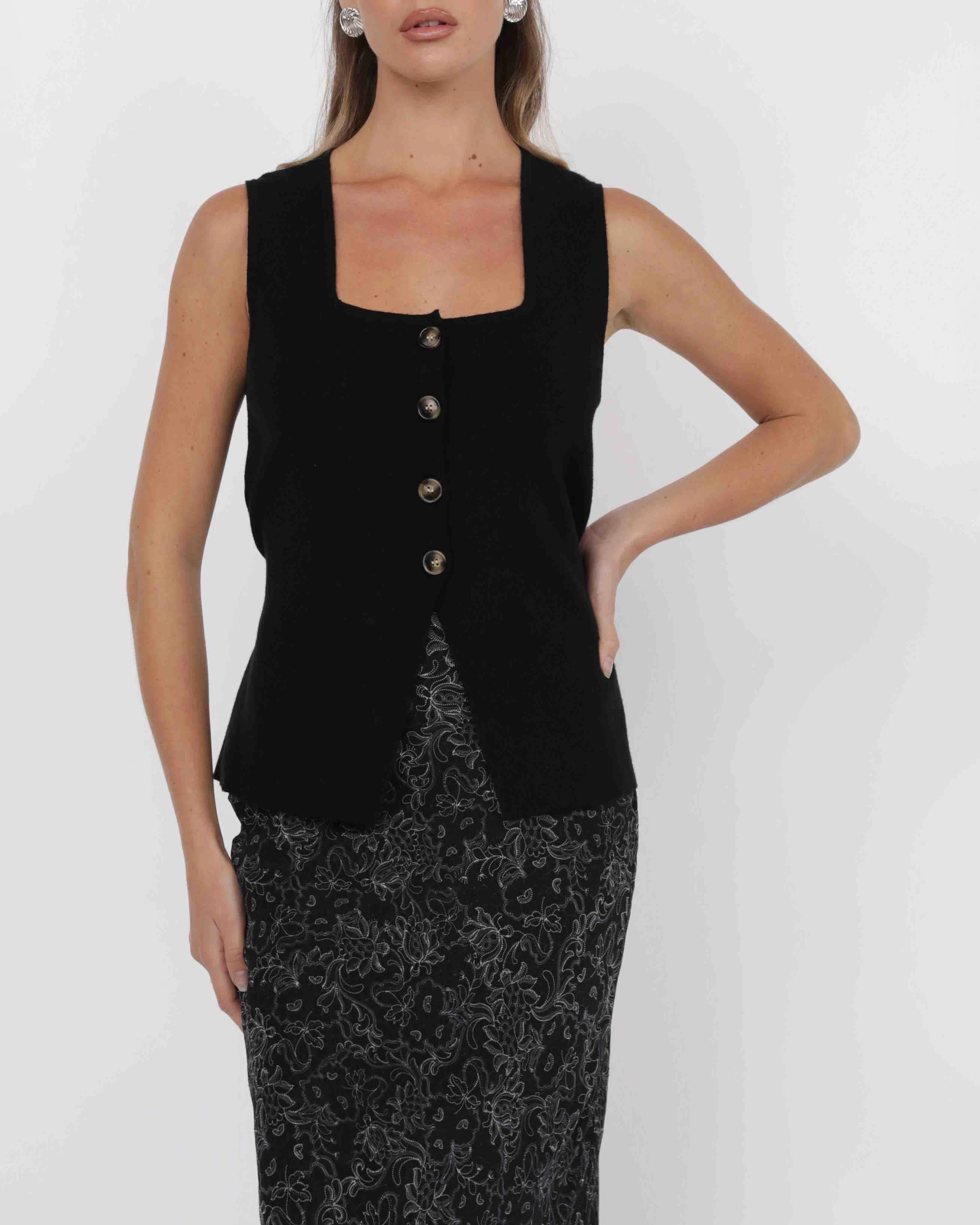 woman wearing knit button down vest in black