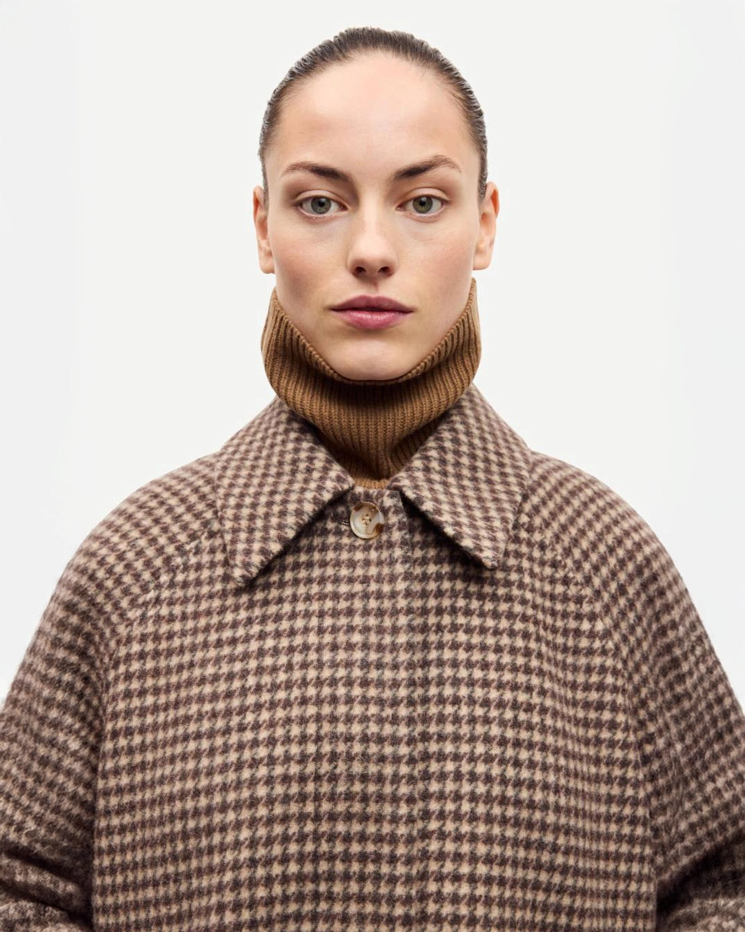 a woman wearing a long brown checked coat by Samsoe Samsoe