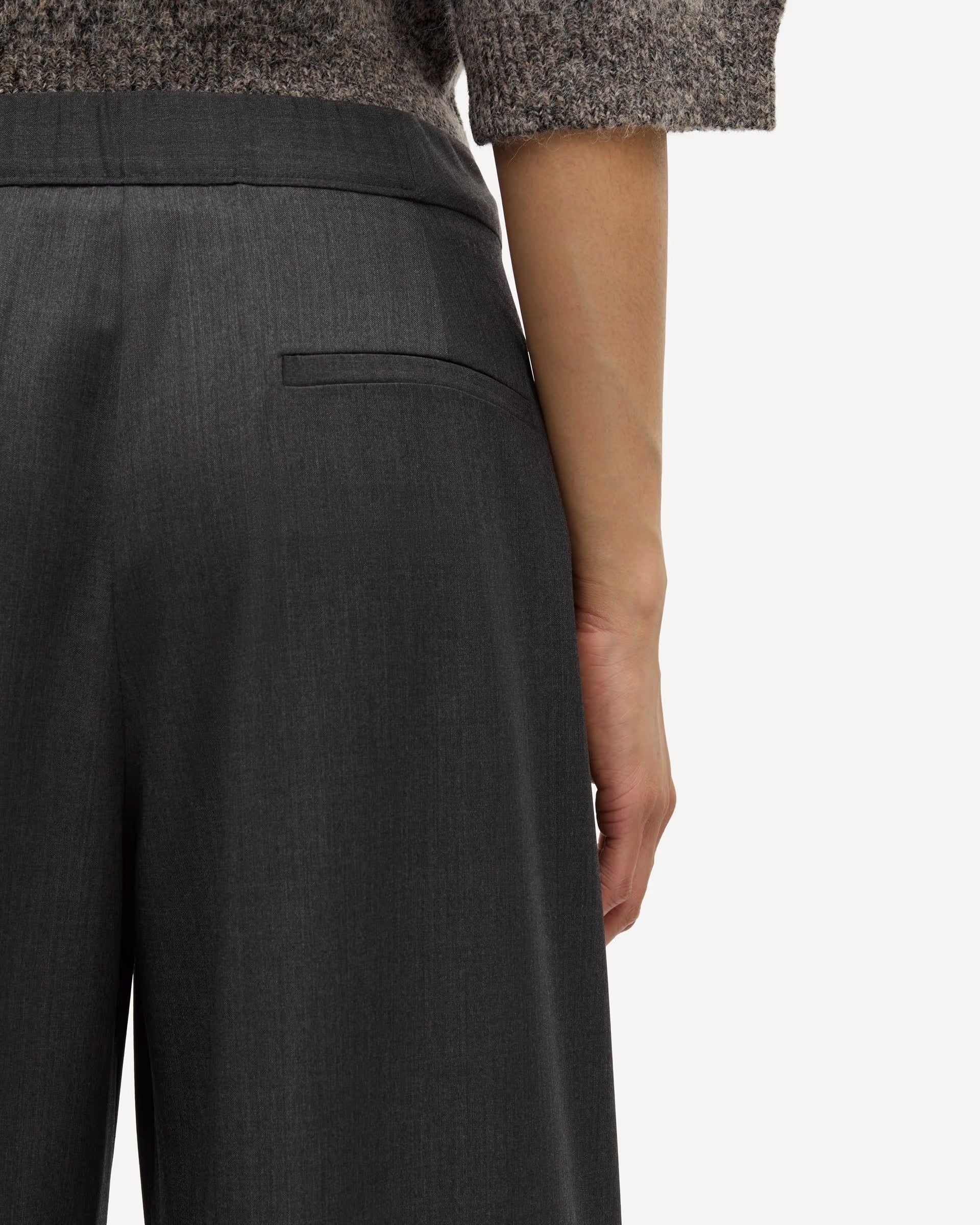 woman wearing grey high-waisted Saroko pants by Samsøe Samsøe