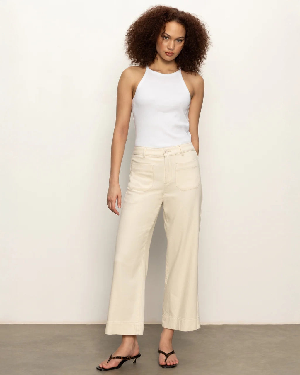 woman wearing beige wide-leg 100% cotton pants by Sanctuary
