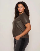 Woman wearing a sequin textured tshirt sweater in brown