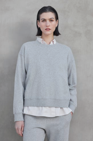 woman wearing a gray sweatshirt