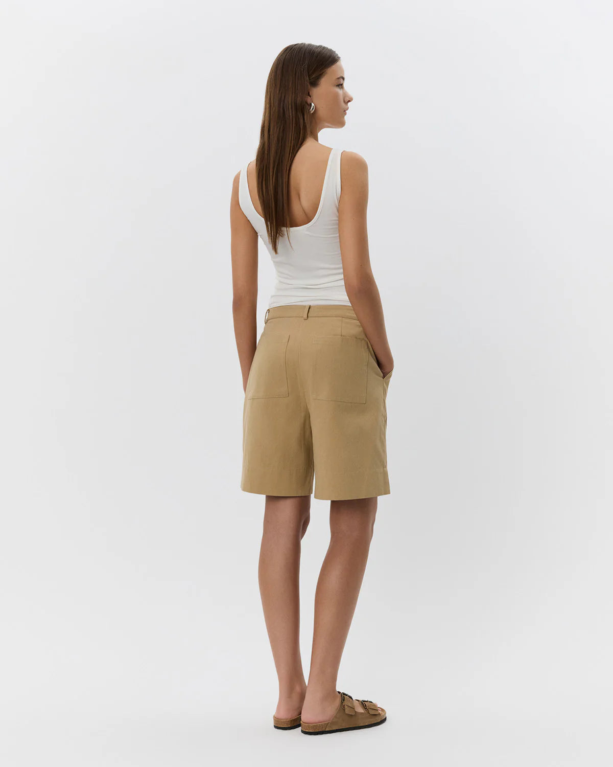 woman wearing camel khaki knee length shorts