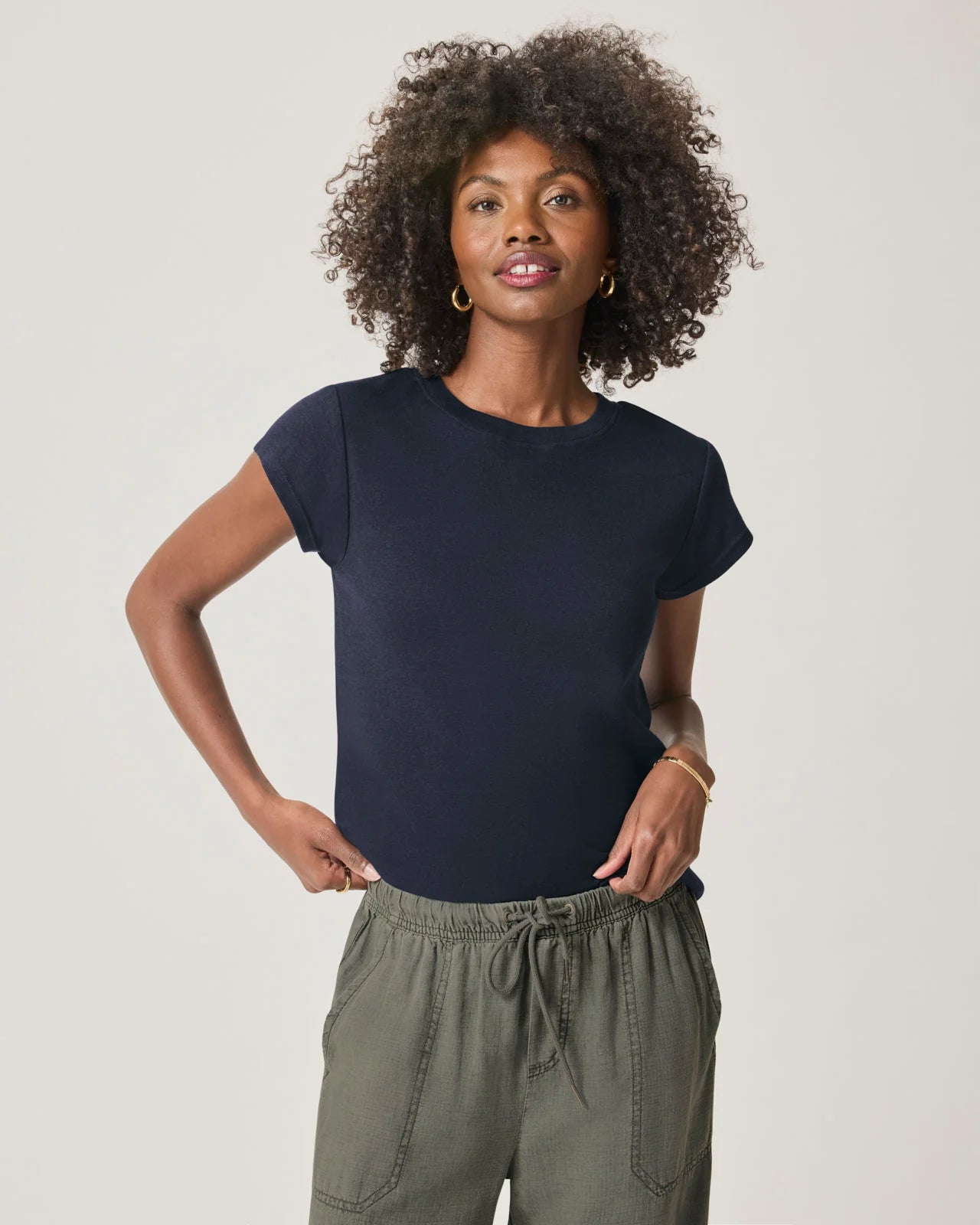 a woman wearing a classic crew neck navy tshirt