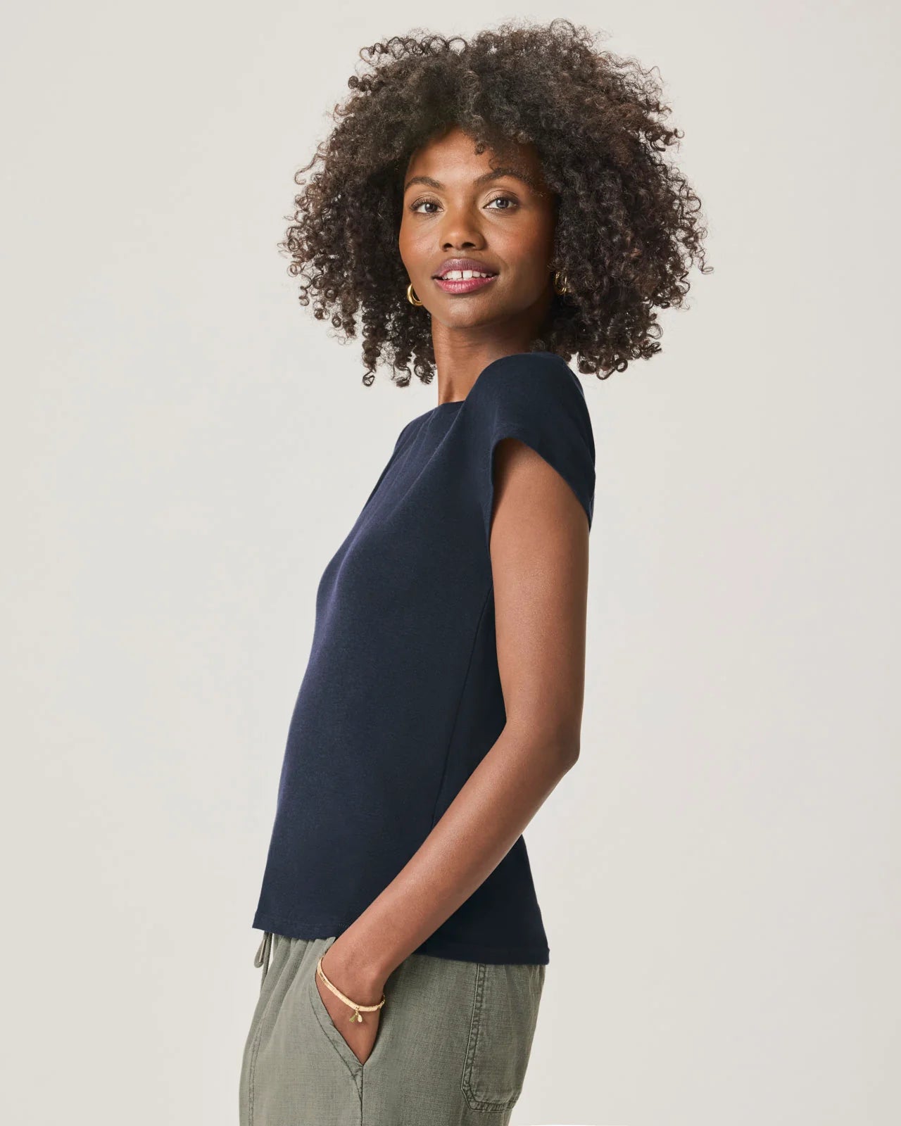 a woman wearing a classic crew neck navy tshirt