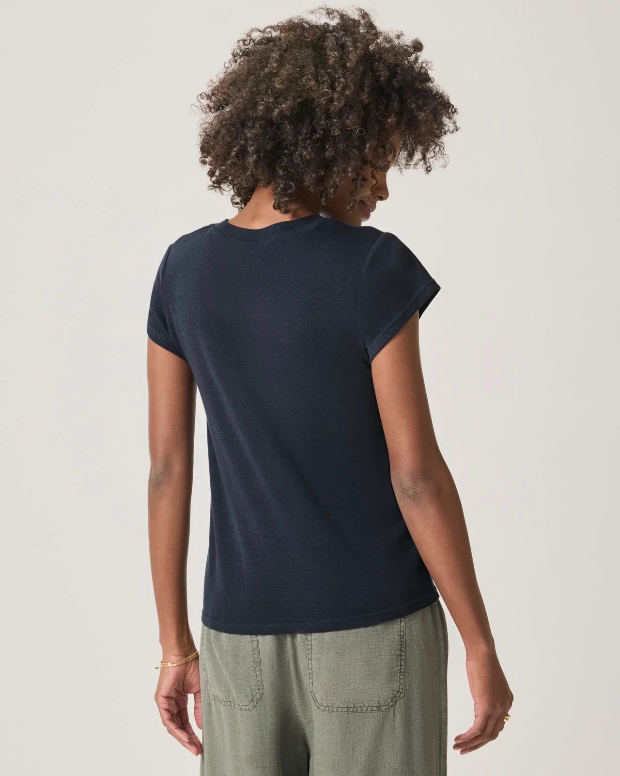 a woman wearing a classic crew neck navy tshirt