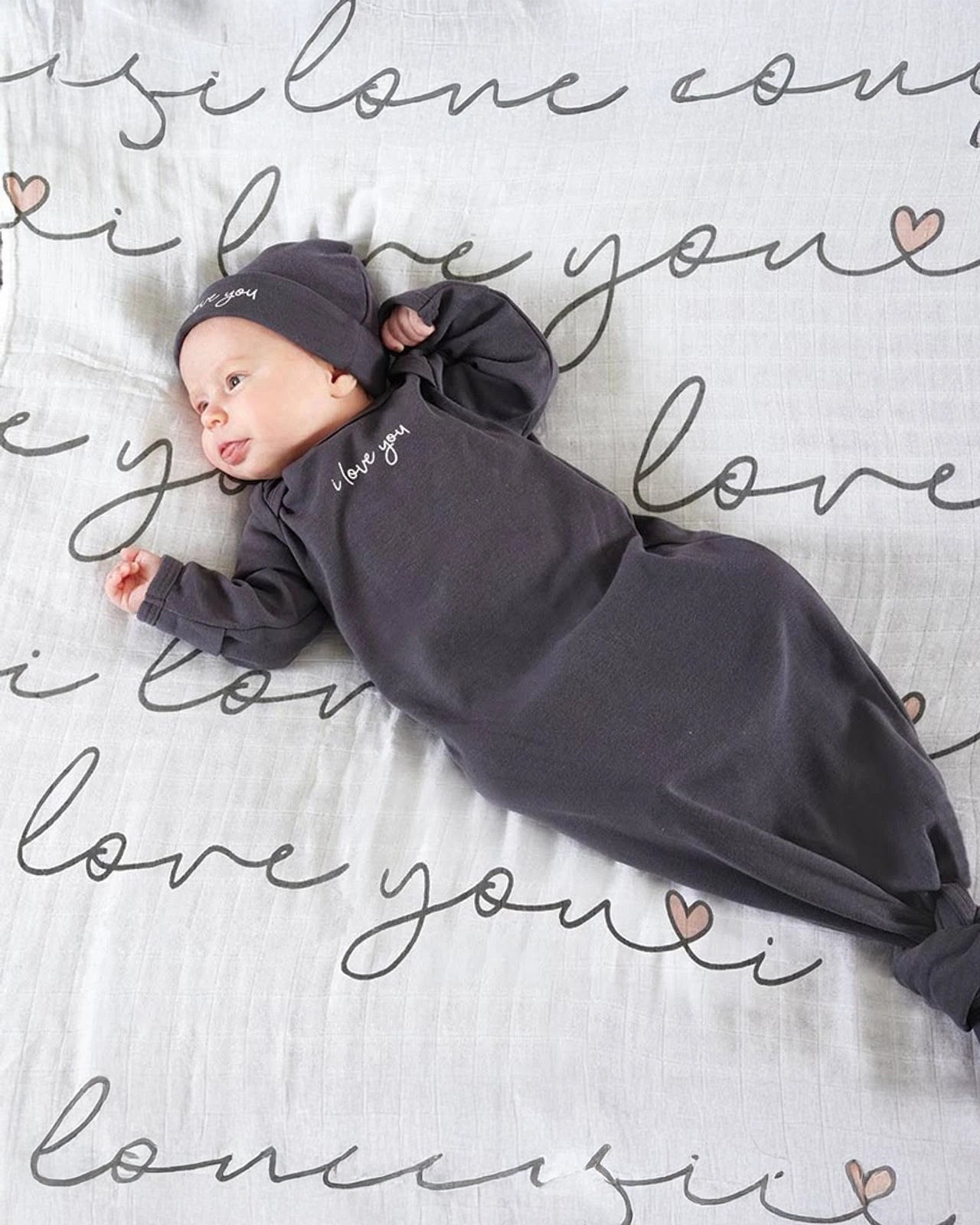 baby wearing 'I Love you' sleep sack and hat