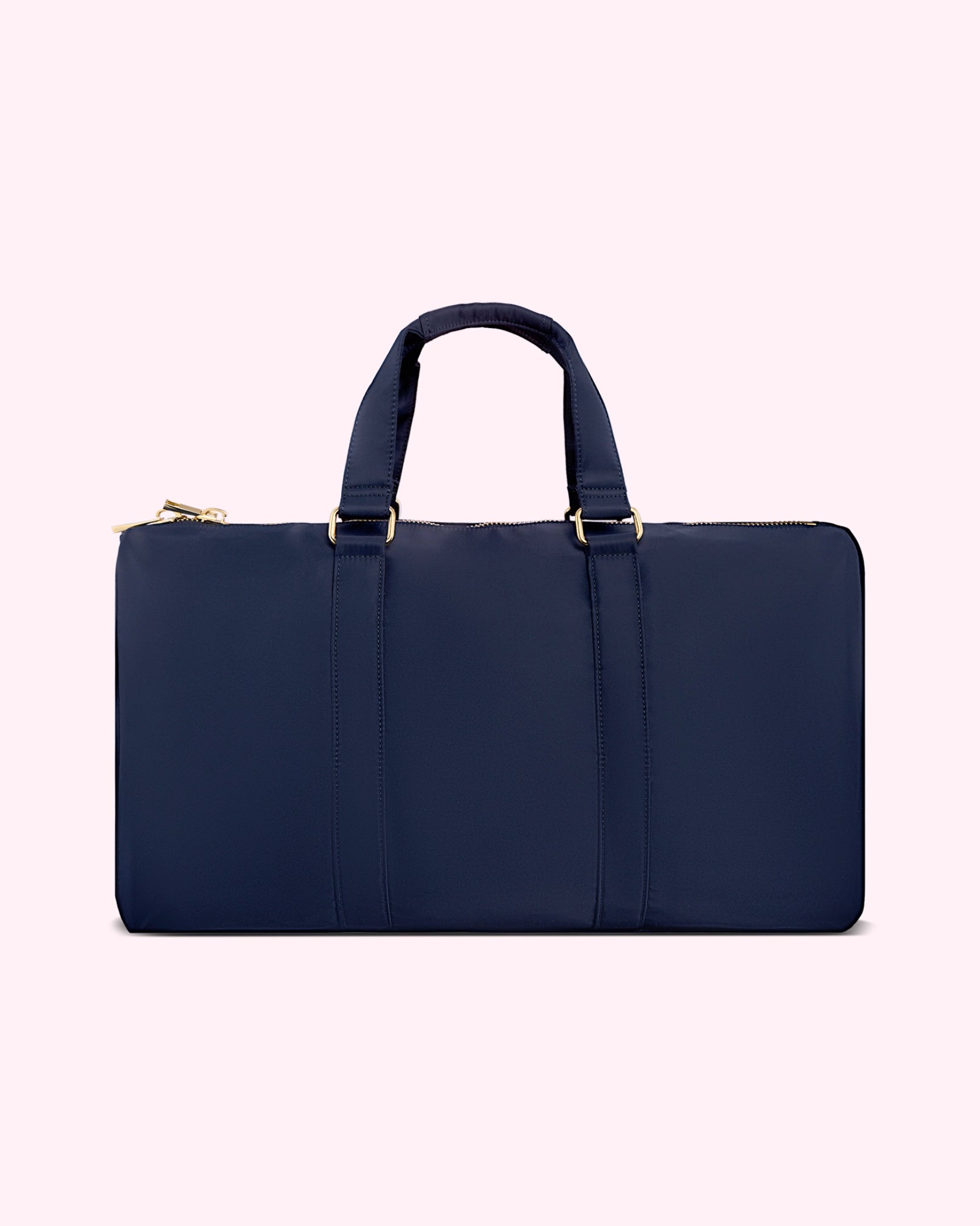 Navy blue duffel bag with gold accents by Stoney Clover Lane
