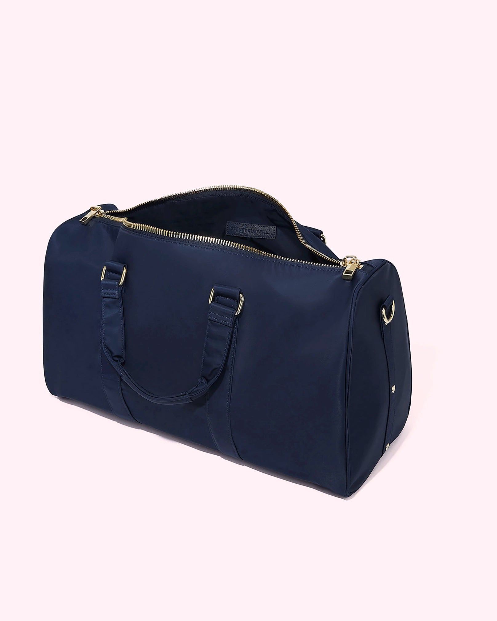 Navy blue duffel bag with gold accents by Stoney Clover Lane